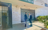 Shas MKs Michael Malkieli and Haim Biton visit ultra-Orthodox draft dodgers in military prison, December 18, 2025. (Courtesy)