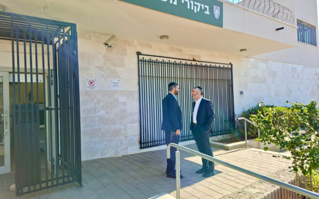 Shas MKs Michael Malkieli and Haim Biton visit ultra-Orthodox draft dodgers in military prison, December 18, 2025. (Courtesy)