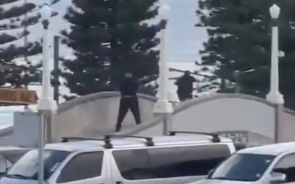 Screenshot from a video showing men shooting at Sydney's Bondi Beach on December 14, 2025. The deadly terror shooting targeted a Jewish event. (X used in accordance with Clause 27a of the Copyright Law) Screenshot from a video showing men shooting at Sydney's Bondi Beach on December 14, 2025. The deadly terror shooting targeted a Jewish event. (X used in accordance with Clause 27a of the Copyright Law)