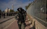 Police and Border Police officers operating in the Bedouin town of Tarabin al-Sana, as part of a days-long crackdown in the southern village on December 30, 2025. (Israel Police)