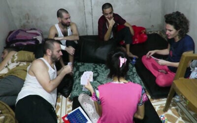 This footage published on December 11, 2025, after being obtained by the IDF from Gaza, shows hostages Hersh Goldberg-Polin, Eden Yerushalmi, Ori Danino, Alex Lobanov, Carmel Gat, and Almog Sarusi in Hamas captivity in late 2023. (Courtesy)