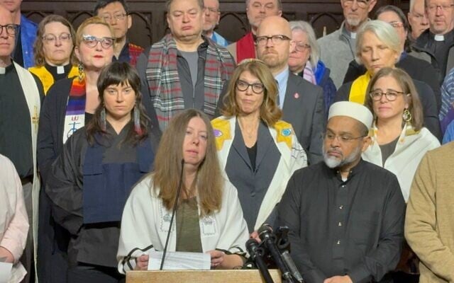 Rabbi Tamar Magill-Grimm, of the Conservative Beth Jacob Congregation in Mendota Heights, Minnesota, speaks out with other faith leaders against Immigration and Customs Enforcement operations in the Twin Cities at a press conference at a Lutheran church in St. Paul, January 20, 2026. Local cantors Tamar Havilio and Rachel Stock Spilker are behind Magill-Grimm to the right. (Courtesy of TC Jewfolk via JTA)
