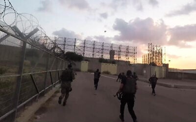Hamas terrorists attack an army base next to the Erez Crossing, on October 7, 2023, in footage released by the terror group. (Screenshot: Telegram)
