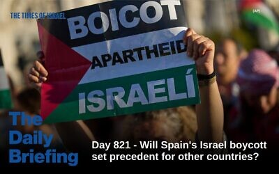 A pro-Palestinian demonstrator holds a banner reading: 'Boycott Israeli apartheid' during a protest in Madrid, Spain, Saturday, Oct. 4, 2025. (Bernat Armangue/AP Photo)
