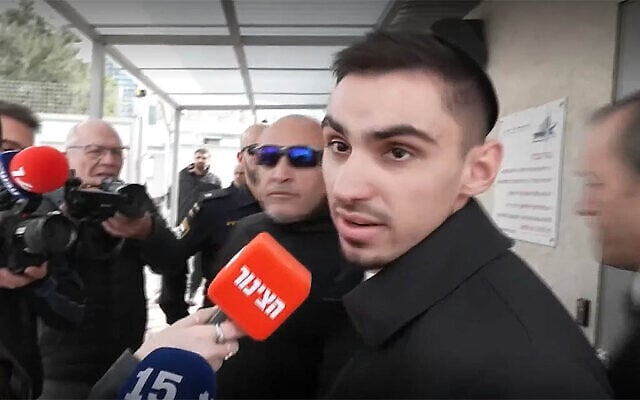 Former hostage Rom Braslavski speaks to the media as he enters the Tel Aviv police station to give testimony on an alleged assault he suffered in the city, January 21, 2026. (Screenshot/Ynet) Former hostage Rom Braslavski speaks to the media as he enters the Tel Aviv police station to give testimony on an alleged assault he suffered in the city, January 21, 2026. (Screenshot/Ynet)