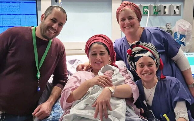 Shira-Leah and Uri Rozman with medical staff at Hadassah Hospital Mount Scopus, with the first baby born in Israel in 2026. (Courtesy) Shira-Leah and Uri Rozman with medical staff at Hadassah Hospital Mount Scopus, with the first baby born in Israel in 2026. (Courtesy)