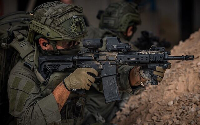A fighter with an Arad assault rifle, manufactured by Israel Weapon Industries, in an undated photo. (Israel Weapon Industries) A fighter with an Arad assault rifle, manufactured by Israel Weapon Industries, in an undated photo. (Israel Weapon Industries)