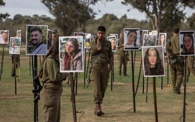 IDF soldiers at the emerging memorial for those killed at the Nova rave on October 7, 2023 (Avishag Shaar-Yashuv) IDF soldiers at the emerging memorial for those killed at the Nova rave on October 7, 2023 (Avishag Shaar-Yashuv)