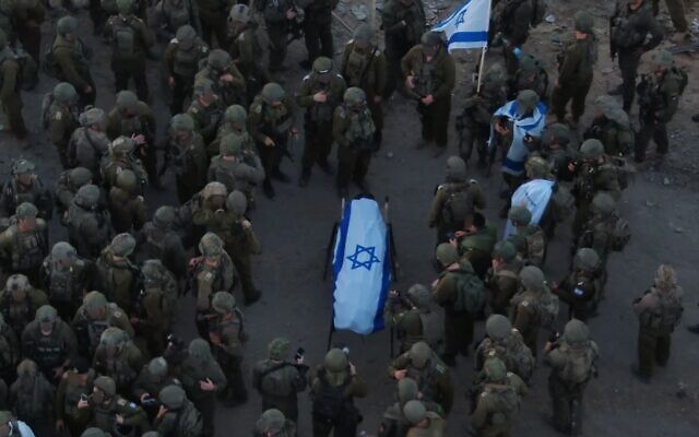 IDF troops are seen in Gaza City for a ceremony honoring slain hostage Master Sgt. Ran Gvili after his body was recovered in Gaza City, on January 26, 2026. (Israel Defense Forces)