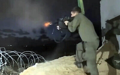 A screenshot from a video uploaded to social media by an IDF soldier in December 2025 showing him firing a volley of bullets. (Used in accordance with Clause 27a of the Copyright Law)