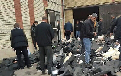 Bodies lie in body bags on the ground as people stand amid the scene outside Kahrizak Forensic Medical Centre in Tehran, Iran, in this screen capture from a video obtained from social media, January 11, 2026. (Social Media/via REUTERS) Bodies lie in body bags on the ground as people stand amid the scene outside Kahrizak Forensic Medical Centre in Tehran, Iran, in this screen capture from a video obtained from social media, January 11, 2026. (Social Media/via REUTERS)