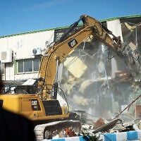 Israel demolishes a structure inside the headquarters of the United Nations Relief and Works Agency (UNRWA) in East Jerusalem on January 20, 2026 (Yonatan Sindel/Flash90)