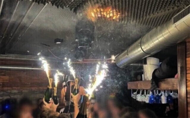 The BBC says it has verified that this image circulating on social media is not manipulated by AI and is a photograph from New Year's Eve celebrations welcoming 2026 in the Swiss Alpine ski resort of Crans-Montana, where at least 40 people were killed and 119 injured in a fire that local authorities say was likely caused by sparkler candles being held too close to the ceiling. (Used in accordance with Clause 27a of the Copyright Law) The BBC says it has verified that this image circulating on social media is not manipulated by AI and is a photograph from New Year's Eve celebrations welcoming 2026 in the Swiss Alpine ski resort of Crans-Montana, where at least 40 people were killed and 119 injured in a fire that local authorities say was likely caused by sparkler candles being held too close to the ceiling. (Used in accordance with Clause 27a of the Copyright Law)