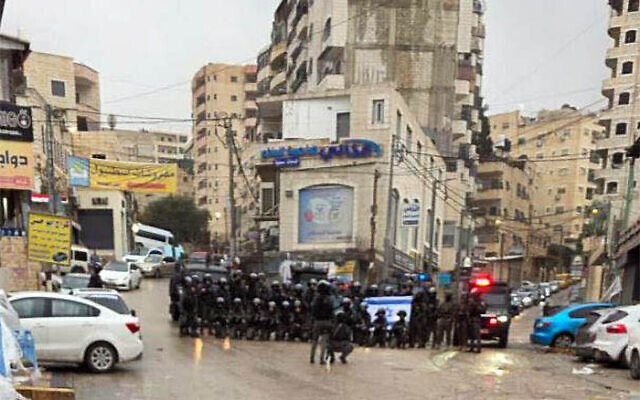Police officers pose for a group photo in the Palestinian refugee camp of Shuafat, east of Jerusalem, January 14, 2026. (Used in accordance with Clause 27a of the Copyright Law) Police officers pose for a group photo in the Palestinian refugee camp of Shuafat, east of Jerusalem, January 14, 2026. (Used in accordance with Clause 27a of the Copyright Law)