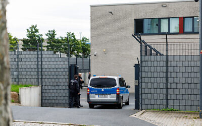 Illustrative: A vehicle of the German judiciary drives into the premises of the courthouse of the higher regional court in Dresden, eastern Germany, on August 5, 2025. (JENS SCHLUETER / AFP)