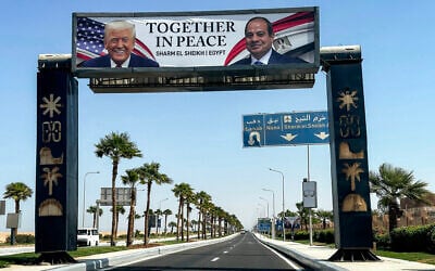 A billboard across the road depicting US President Donald Trump and Egyptian President Abdel-Fattah el-Sissi with the slogan "together in peace" is pictured in Sharm el-Sheikh on October 14, 2025. (Khaled Desouki/AFP)