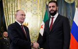 Russian President Vladimir Putin and Syrian interim president Ahmed al-Sharaa shake hands during their meeting at the Grand Kremlin Palace in Moscow on October 15, 2025. (Alexander Zemlianichenko / POOL / AFP)