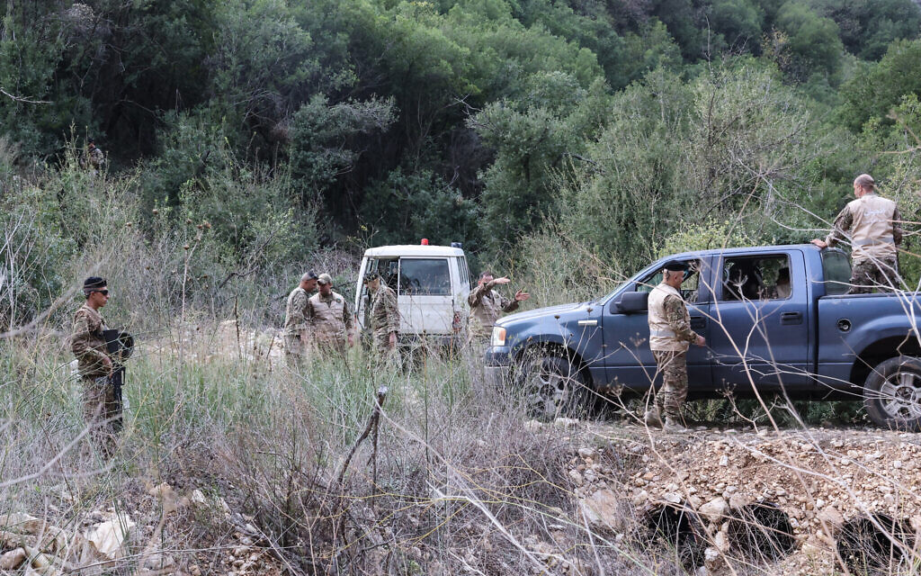 This photograph taken during a press tour organized by the Lebanese army shows soldiers standing near an abandoned tunnel (unseen) said to have been used by Hezbollah, in a mountainous valley on the outskirts of the southern village of Zibqin, on November 28, 2025. (Anwar Amro / AFP)