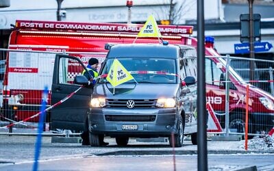 An ambulance is seen at the site of an explosion that ripped through the bar Le Constellation in Crans-Montana, a luxury ski resort town in Switzerland, on January 1, 2026. (Maxime Schmid/AFP)
