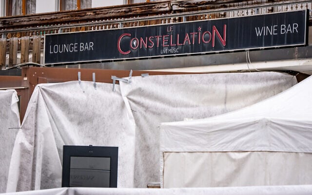 This photograph shows the entrance of the Le Constellation bar, where a fire ripped through the venue during New Year's celebrations in the Alpine ski resort town of Crans-Montana, killing around 40 people and injuring more than 100 others, in Crans-Montana, Switzerland, on January 2, 2026. (MAXIME SCHMID / AFP) This photograph shows the entrance of the Le Constellation bar, where a fire ripped through the venue during New Year's celebrations in the Alpine ski resort town of Crans-Montana, killing around 40 people and injuring more than 100 others, in Crans-Montana, Switzerland, on January 2, 2026. (MAXIME SCHMID / AFP)