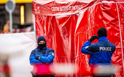 Police officers control the entrance to the bar Le Constellation where a fire ripped through the venue during New Year's celebrations in the Alpine ski resort town of Crans-Montana killing around 40 people and injuring more than 100 others, in Crans-Montana, Switzerland, on January 2, 2026. (MAXIME SCHMID / AFP)