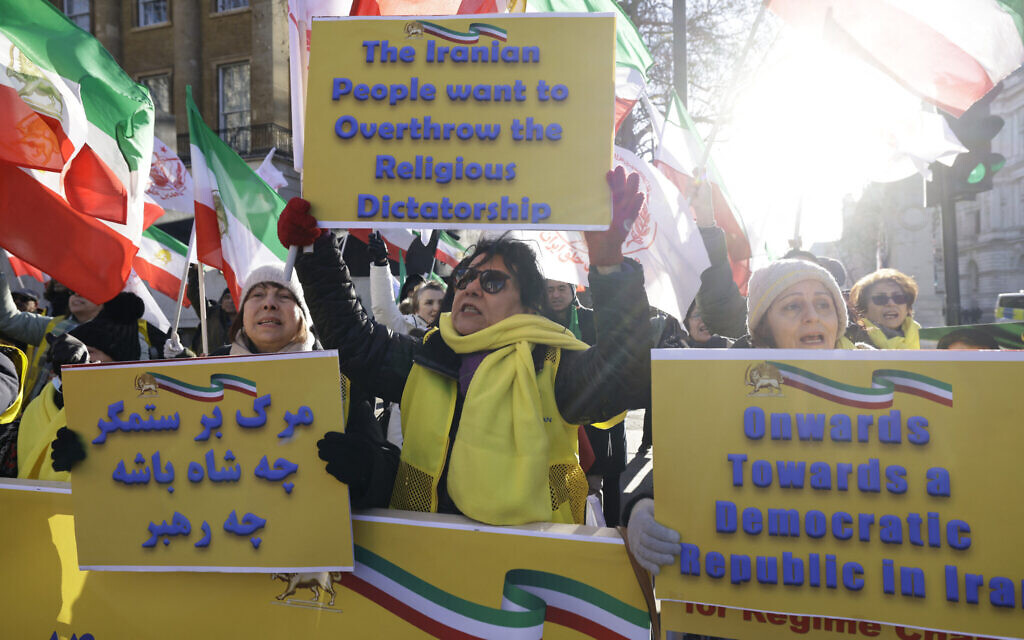 Protesters gather with placards outside the gates of Downing Street to attend a London rally in solidarity with Iranian protesters, organized by the Association of Anglo-Iranian Women in the UK, in central London on January 3, 2026, to protest against the Iranian regime's crackdown on protests. (Brook Mitchell/AFP)