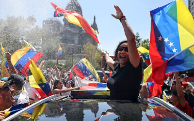 Venezuelans living in Chile celebrate in Santiago on January 3, 2026, after US forces captured Venezuelan leader Nicolas Maduro. (Javier TORRES / AFP)