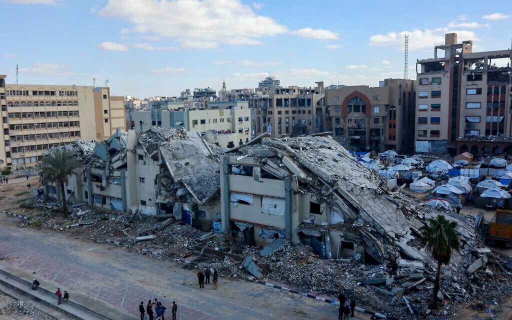 Illustrative: This picture shows a partial view of damaged buildings in Gaza City on January 3, 2026. (Omar AL-QATTAA / AFP)