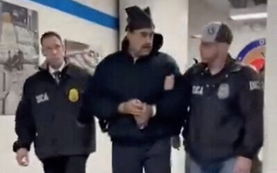 This screengrab taken from the X account of Rapid Response 47, an official White House account, shows Venezuelan President Nicolas Maduro (center) escorted by DEA agents inside the headquarters of the US Drug Enforcement Administration in Manhattan, New York City, January 3, 2026. (X account of Rapid Response 47 / AFP)