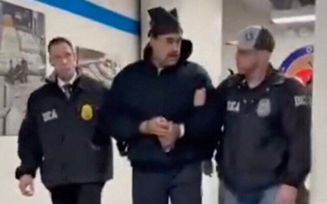 This screengrab taken from the X account of Rapid Response 47, an official White House account, shows Venezuelan President Nicolas Maduro (center) escorted by DEA agents inside the headquarters of the US Drug Enforcement Administration in Manhattan, New York City, January 3, 2026. (X account of Rapid Response 47 / AFP)