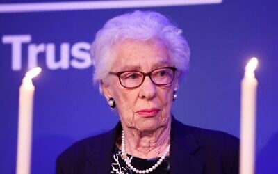 Eva Schloss, the step-sister of Anne Frank and honorary president of the Anne Frank Trust UK, takes part in a candle lighting ceremony during a reception to mark Holocaust Memorial Day and the 75th publication of Anne Frank's diary for the Anne Frank Trust in London, on January 20, 2022. (Chris Jackson / POOL / AFP)