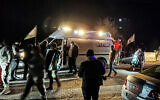 Emergency services and local citizens arrive at the scene following an Israeli strike on the village of Kfar Hatta, in southern Lebanon on January 5, 2026. (Mahmoud ZAYYAT / AFP)