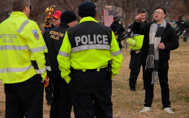 Jake Lang (right), who was charged with eight counts of assaulting officers on January 6, 2021, before his pardon, threatens DC Metropolitan Police officers during a rally and memorial march marking five years since the storming of the US Capitol, on January 6, 2026, in Washington, DC. (Chip Somodevilla/Getty Images/AFP) Jake Lang (right), who was charged with eight counts of assaulting officers on January 6, 2021, before his pardon, threatens DC Metropolitan Police officers during a rally and memorial march marking five years since the storming of the US Capitol, on January 6, 2026, in Washington, DC. (Chip Somodevilla/Getty Images/AFP)
