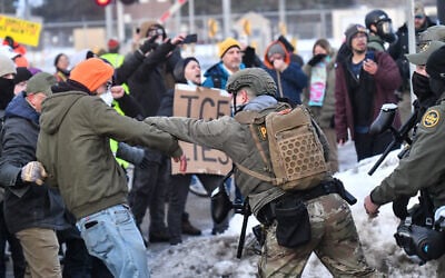 Protesters clash with federal agents outside the Bishop Henry Whipple Federal Building in Saint Paul, Minnesota, on January 8, 2026. (Octavio JONES / AFP)
