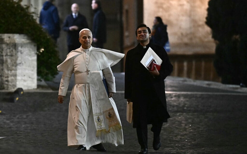 Pope Leo XIV leaves the Vatican with his private secretary Edgard Iván Rimaycuna Inga after a two-day meeting with cardinals as part of an extraordinary Consistory in the Vatican on January 8, 2026. (Filippo MONTEFORTE / AFP)