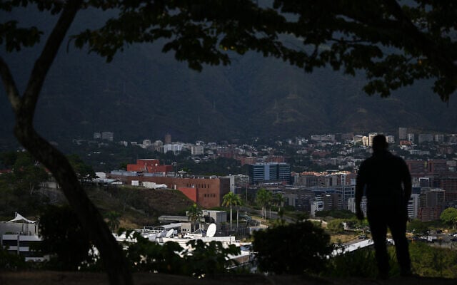 A man is seen with the city of Caracas in the background on January 9, 2026 (Federico PARRA / AFP) A man is seen with the city of Caracas in the background on January 9, 2026 (Federico PARRA / AFP)