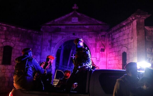 Syrian government security forces sit in the back of a pick-up truck deployed outside a church following a ceasefire in the city of Aleppo, Syria, early on January 11, 2026. (Bakr Alkasem / AFP) Syrian government security forces sit in the back of a pick-up truck deployed outside a church following a ceasefire in the city of Aleppo, Syria, early on January 11, 2026. (Bakr Alkasem / AFP)