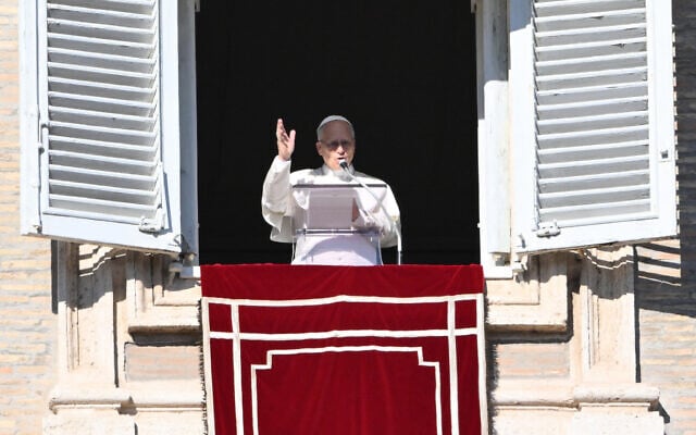 Pope Leo XIV addresses the crowd from the window of the apostolic palace overlooking St. Peter's square during his Sunday Angelus prayer at the Vatican on January 11, 2026. (Alberto PIZZOLI / AFP) Pope Leo XIV addresses the crowd from the window of the apostolic palace overlooking St. Peter's square during his Sunday Angelus prayer at the Vatican on January 11, 2026. (Alberto PIZZOLI / AFP)