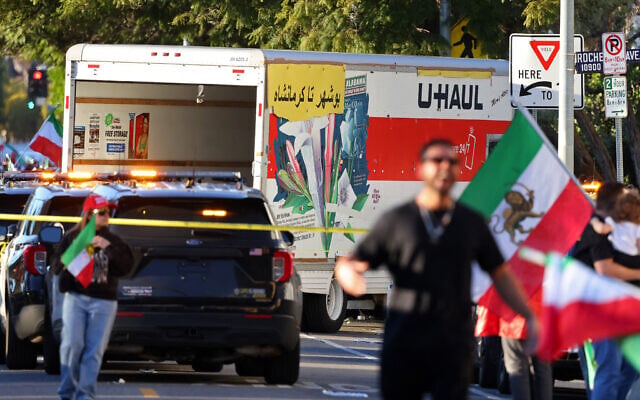 People walk near a U-Haul truck that reportedly was driven into a crowd during a rally against the Iranian regime on January 11, 2026, in Los Angeles, California. (Jonathan Alcorn/AFP) People walk near a U-Haul truck that reportedly was driven into a crowd during a rally against the Iranian regime on January 11, 2026, in Los Angeles, California. (Jonathan Alcorn/AFP)