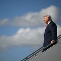 US President Donald Trump steps off Air Force One at Palm Beach International Airport in West Palm Beach, Florida on January 16, 2026. (ANDREW CABALLERO-REYNOLDS / AFP)