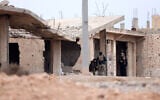 Illustrative: Syrian government forces deploy near the front line in Dibsi Faraj, in the northern Syrian Raqa province, on January 17, 2026. (OMAR HAJ KADOUR / AFP)