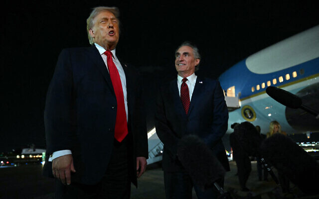 US President Donald Trump speaks with reporters as the Secretary of the Interior Doug Burgum (R) looks on, before boarding Air Force One at Palm Beach International Airport, in West Palm Beach, Florida on January 19, 2026 (ANDREW CABALLERO-REYNOLDS / AFP) US President Donald Trump speaks with reporters as the Secretary of the Interior Doug Burgum (R) looks on, before boarding Air Force One at Palm Beach International Airport, in West Palm Beach, Florida on January 19, 2026 (ANDREW CABALLERO-REYNOLDS / AFP)