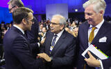 French President Emmanuel Macron (L) greets Lebanese Prime Minister Nawaf Salam (C) next to King Philippe of Belgium (R) during the World Economic Forum (WEF) annual meeting in Davos on January 20, 2026. (Ludovic Marin/AFP)