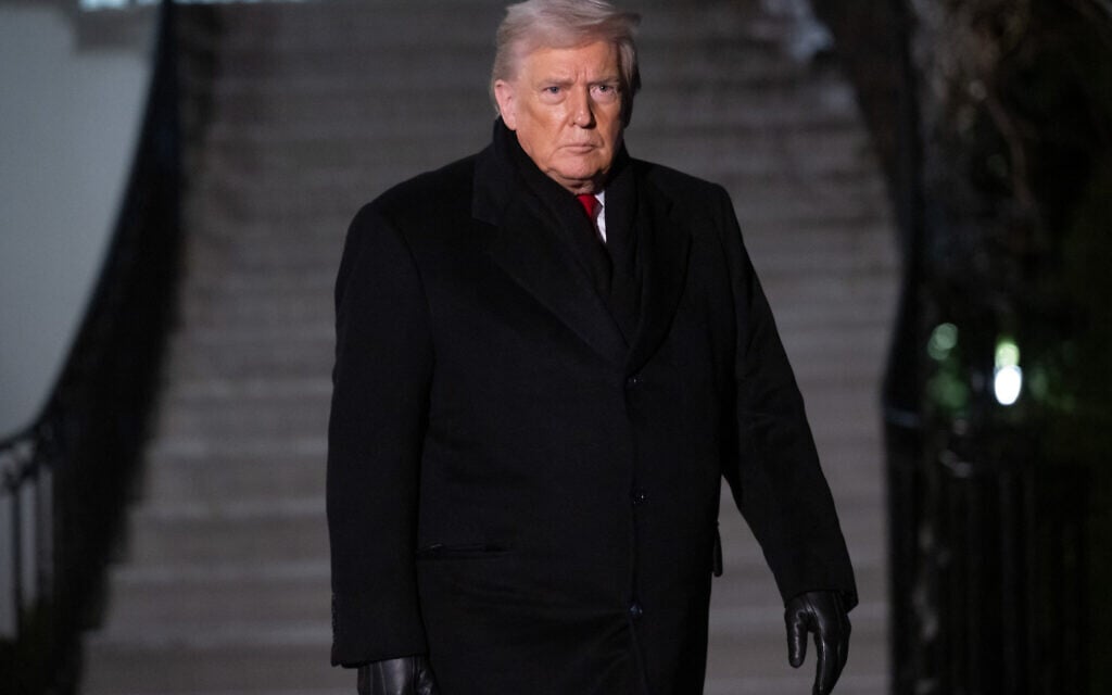 US President Donald Trump walks to board Marine One at the White House in Washington, DC, on January 20, 2026.(Saul Loeb/AFP)