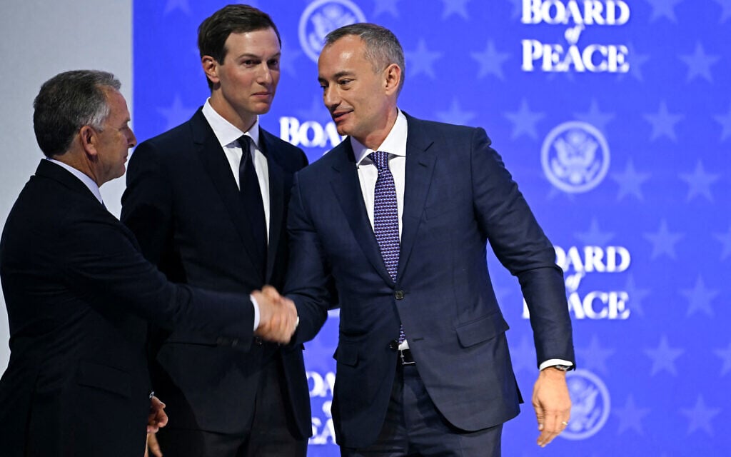 US Special Envoy Steve Witkoff (L) shakes hands with Board of Peace top envoy Nickolay Mladenov, right, next to US President Donald Trump's son-in-law and key adviser Jared Kushner, during a meeting of the Board of Peace at the World Economic Forum (WEF) annual meeting in Davos, Switzerland, on January 22, 2026. (Fabrice COFFRINI / AFP)