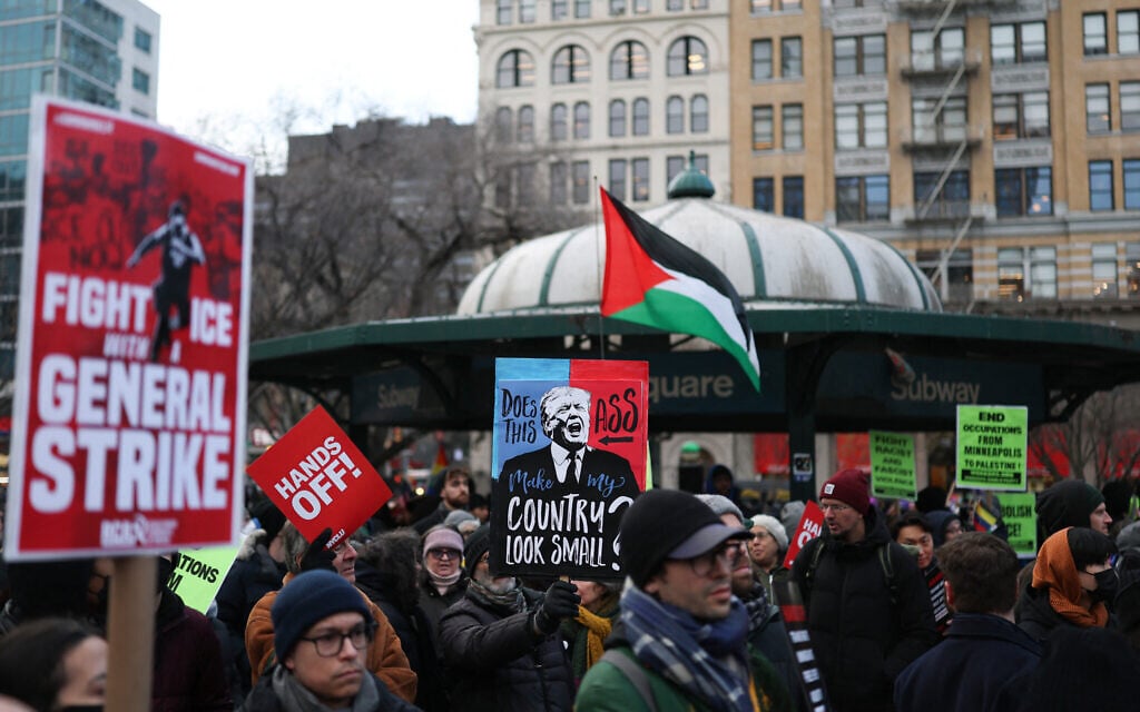 People hold anti-Trump signs as they march in an "ICE Out" protest in New York on January 23, 2026 against US Immigration and Customs Enforcement (ICE). (ANGELA WEISS / AFP)