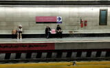 Commuters wait for their train at a metro station in Iran's capital Tehran on January 24, 2026. (ATTA KENARE / AFP)