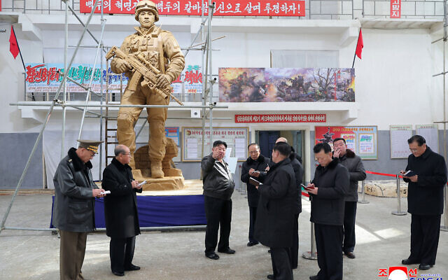 This picture taken on January 25, 2026 and released by North Korea's official Korean Central News Agency (KCNA) on January 26, 2026 shows North Korean leader Kim Jong Un (C) visiting the Mansudae Art Studio to inspect sculptures to be displayed at the Memorial Museum of Combat Feats at the Overseas Military Operations, in Pyongyang. (Photo by KCNA VIA KNS / AFP)