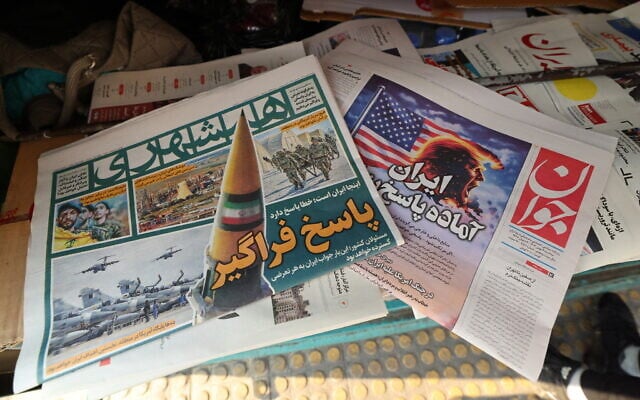 A photograph shows newspapers, one of them (R) with a headline in Farsi reading, 'Iran is ready for a big response,' at a kiosk in Tehran, Iran, on January 27, 2026. (ATTA KENARE / AFP) A photograph shows newspapers, one of them (R) with a headline in Farsi reading, 'Iran is ready for a big response,' at a kiosk in Tehran, Iran, on January 27, 2026. (ATTA KENARE / AFP)