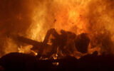 Illustrative: Disposed articles are burnt in fierce fires in the incinerators of an incineration plant on April 17, 2007, in Singapore. (AP/Wong Maye-E)